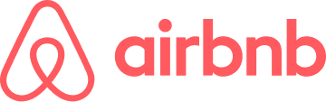 밝은 배경 위에 소문자 빨간색 airbnb 글자 옆에, 거꾸로 된 하트 모양을 닮은 빨간색 추상적 심볼이 그려진 Airbnb .