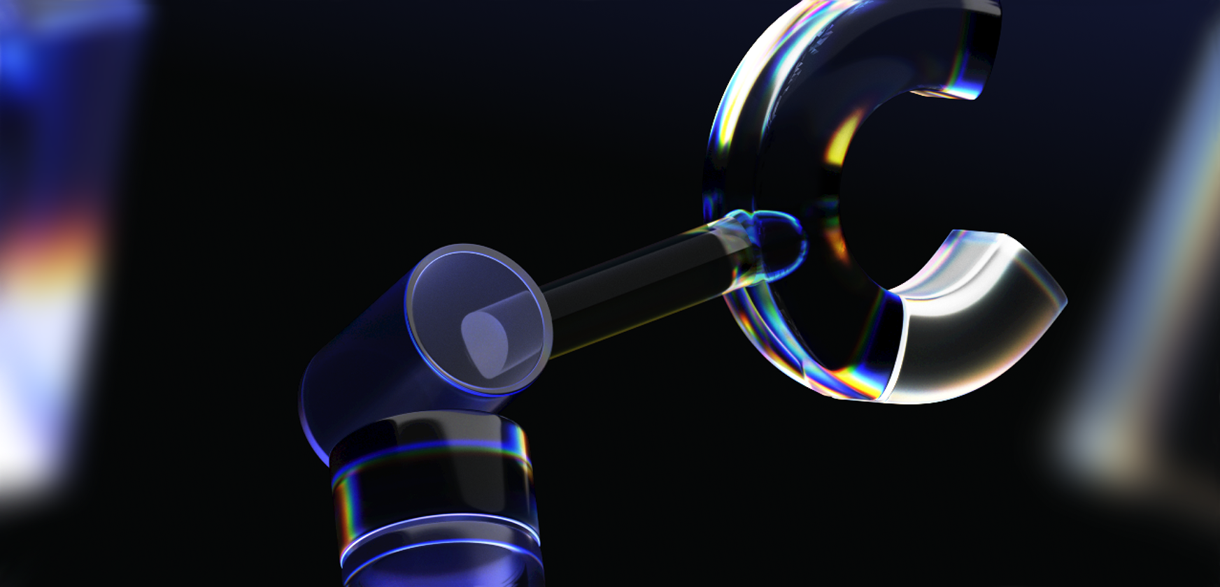 A close-up of a translucent robotic arm with a clamp-like hand, featuring blue and rainbow-colored light reflections, set against a dark blurred background.