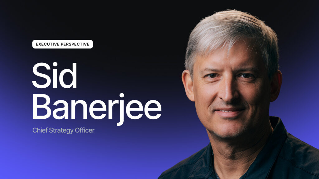 Portrait of a man with short gray hair smiling, next to text that reads Sid Banerjee, Chief Strategy Officer, Executive Perspective, on a dark gradient background.