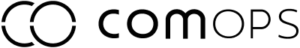 The image shows a logo with stylized text reading COMOPS in black, modern font on a light background. The C and O are larger and linked together.